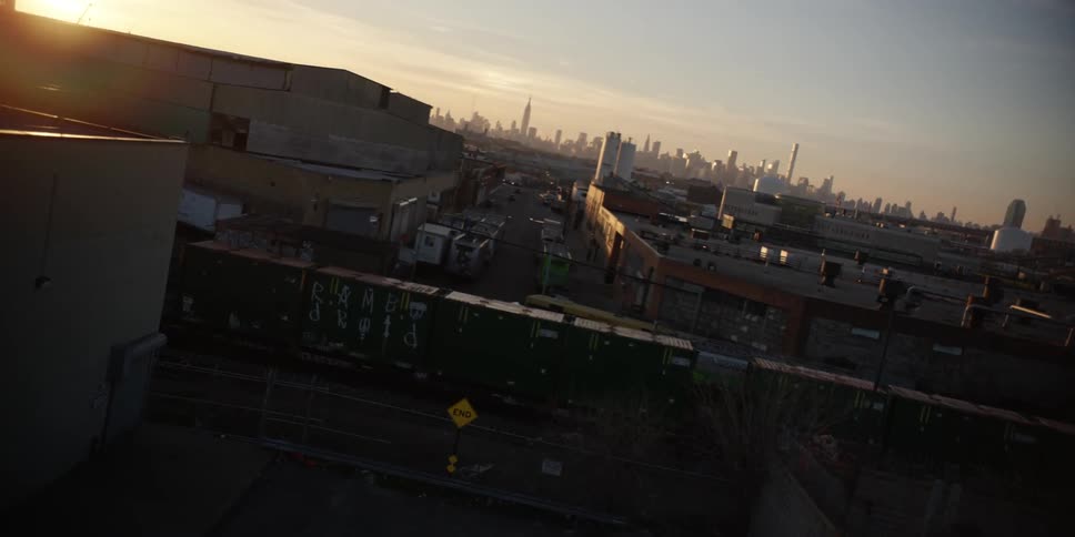 An aerial view of a rail yard in an urban area