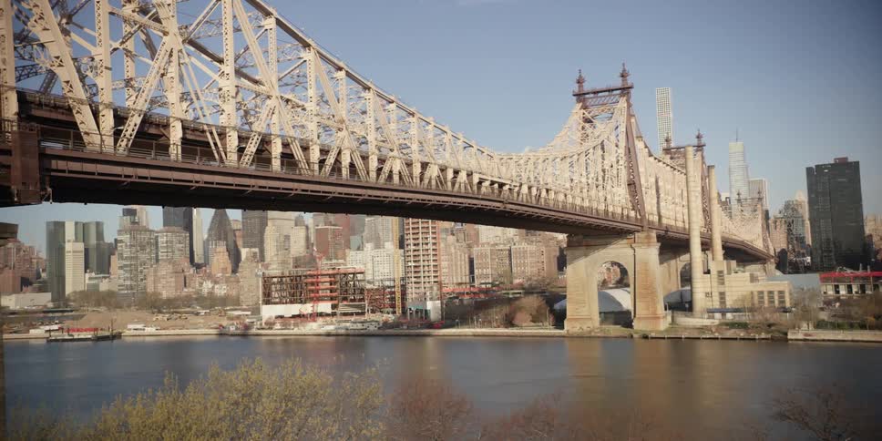 A bridge spanning a river in a large city