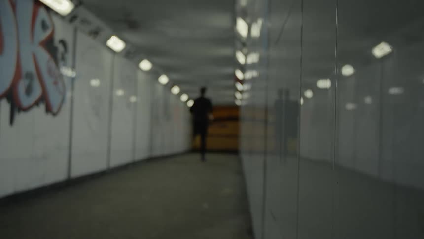 The tunnel is empty at night