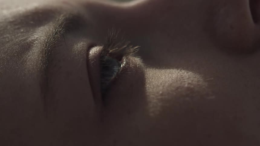 A woman's eye twitches