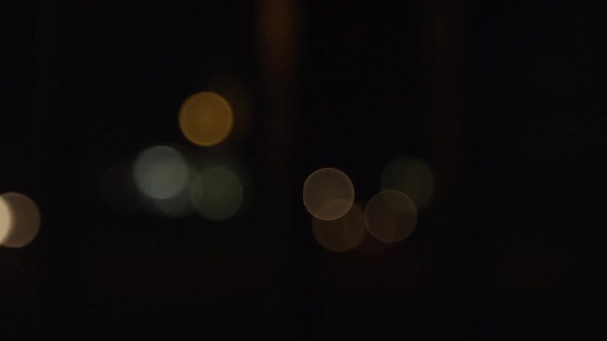 The vehicles pass buy lighting the road at night