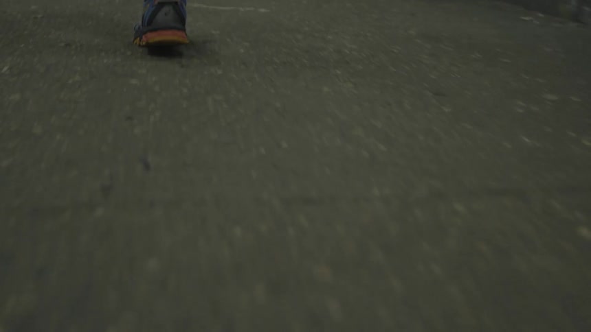 The person is jogging in the street