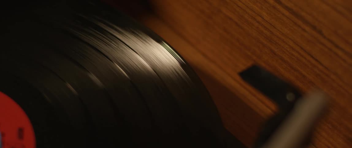 A vinyl record spins on a record player