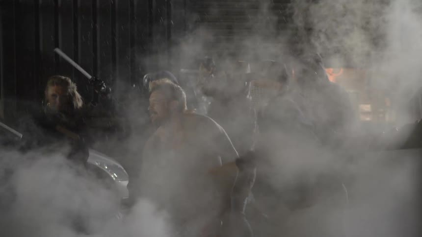 Tear gas covers the crowd of protestors as they attack