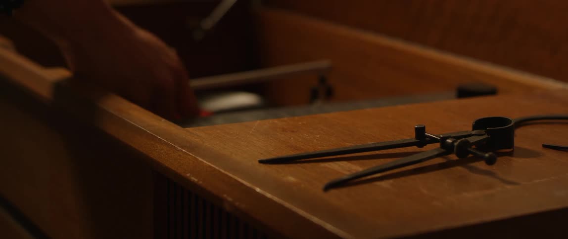 Person stops a record on a turntable