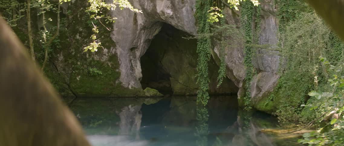 The cave ahead is dark and full of water