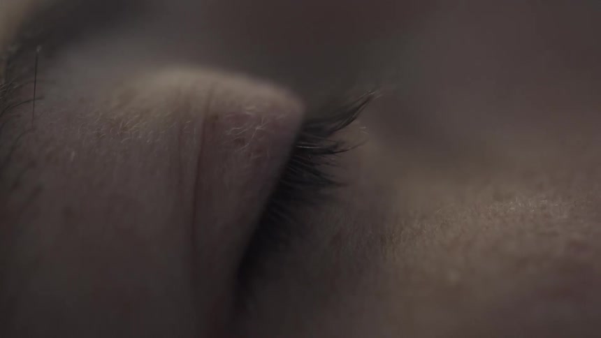 The person rests with their eyelid fluttering