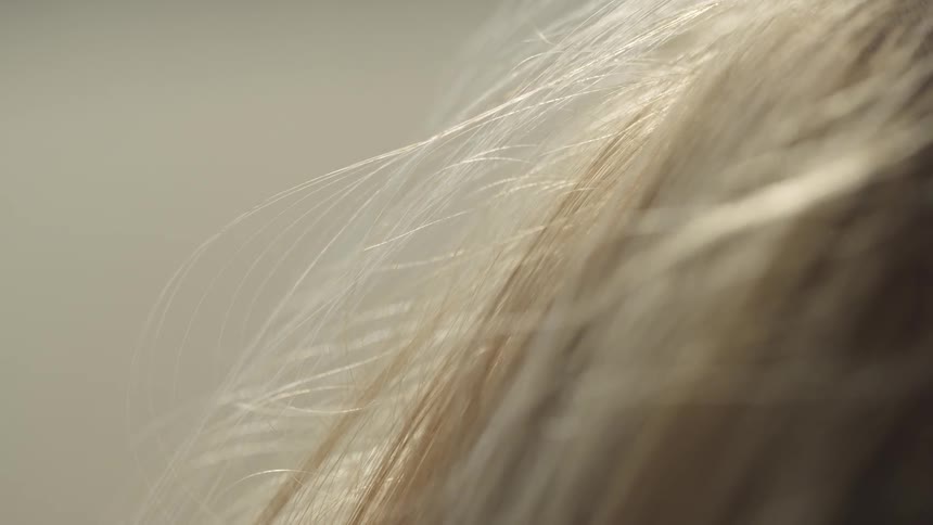 The wind blows the blonde hair