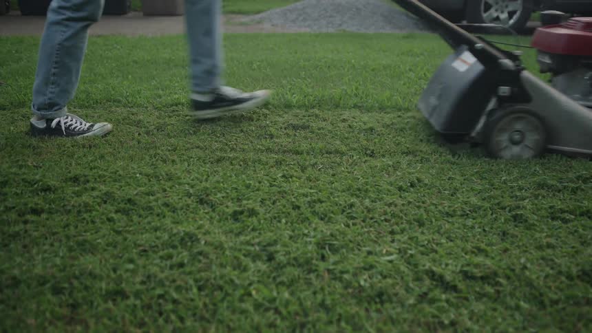 Legs and Lawnmower Go Through Frame