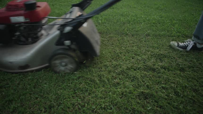 Feet and Lawnmower Go Through Frame