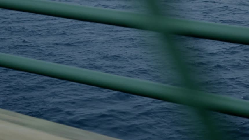 The water is rough below the bridge