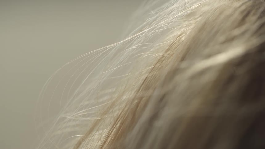 Sun shines on a person's hair