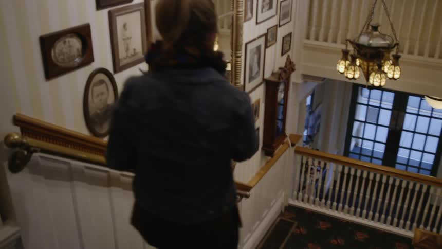Woman descending a staircase