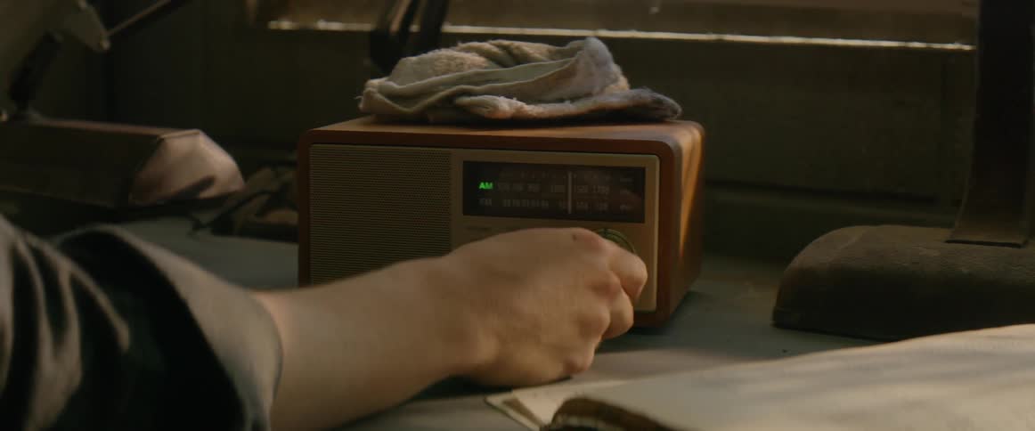 The person operates the radio