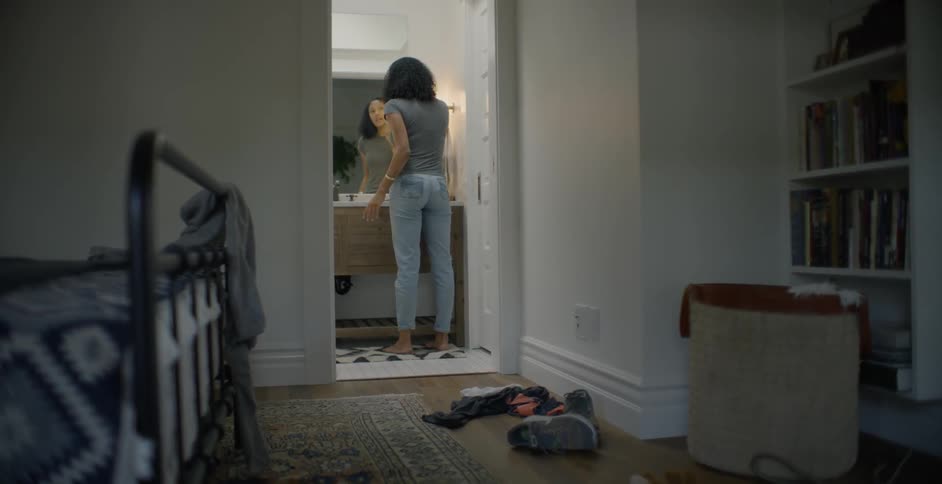 Woman looks into a mirror