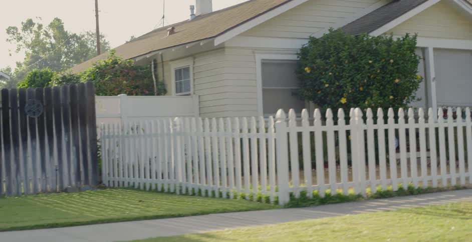 The yard in front of the home is empty