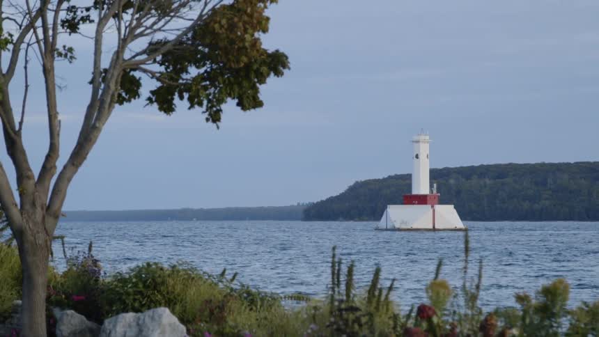 The water is rough by the lighthouse