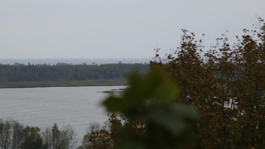 The lake is calm on a cloudy day