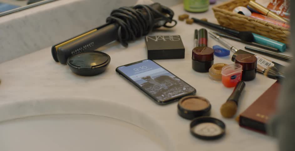 Many cosmetics on the bathroom counter