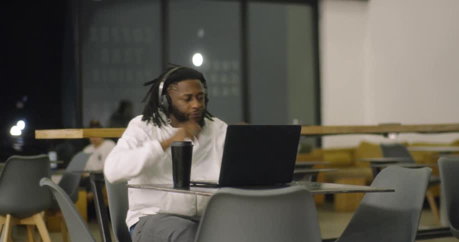 Artist Mixing Music At Coffee Shop