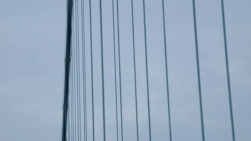 Lines of wires holding up a bridge