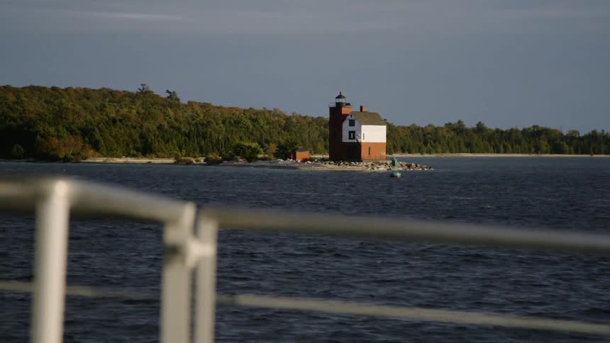 The boat sails towards the shore
