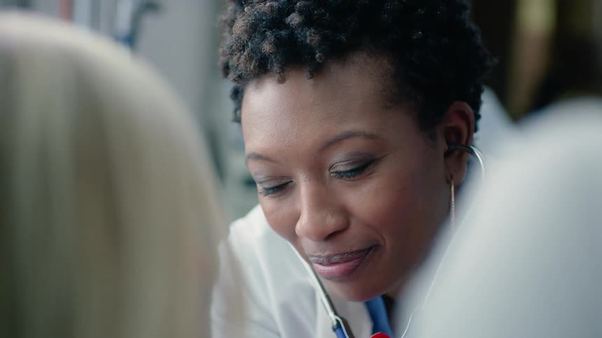 A doctor is talking to her patient