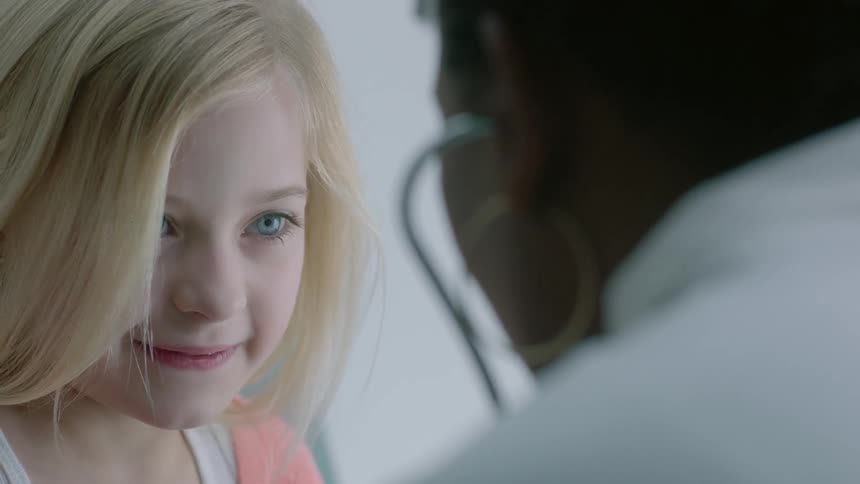 A girl being examined by doctor