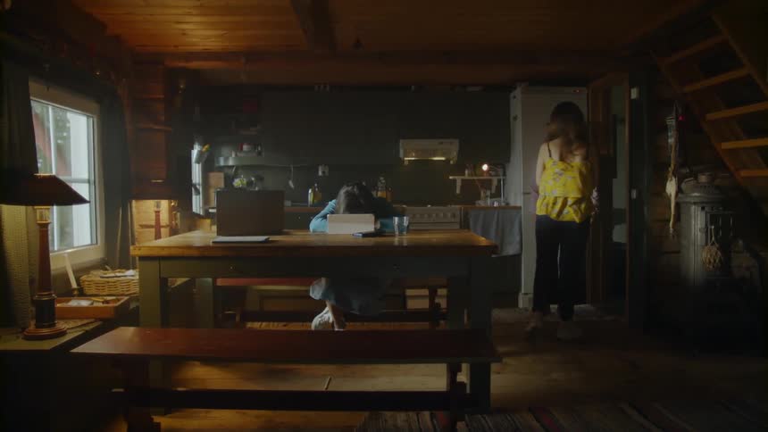 The three women discuss things in the dining room