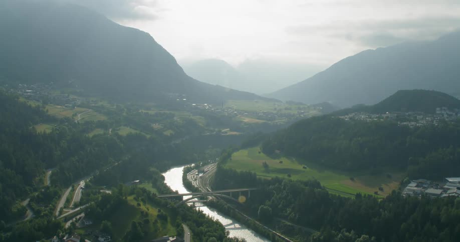 The river runs in curves through the mountain range