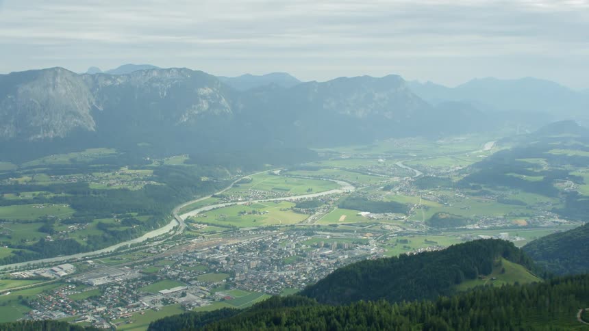 The town by the mountain is covered in fog