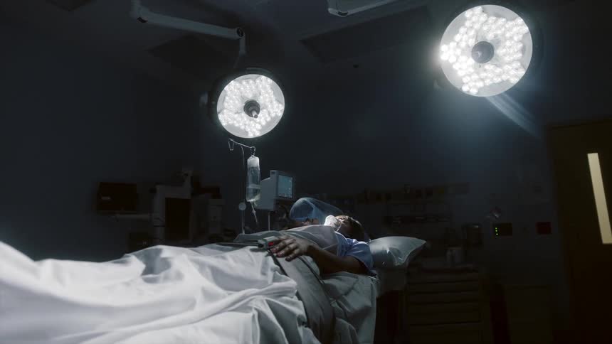 Nurse working near a patient in a surgery room