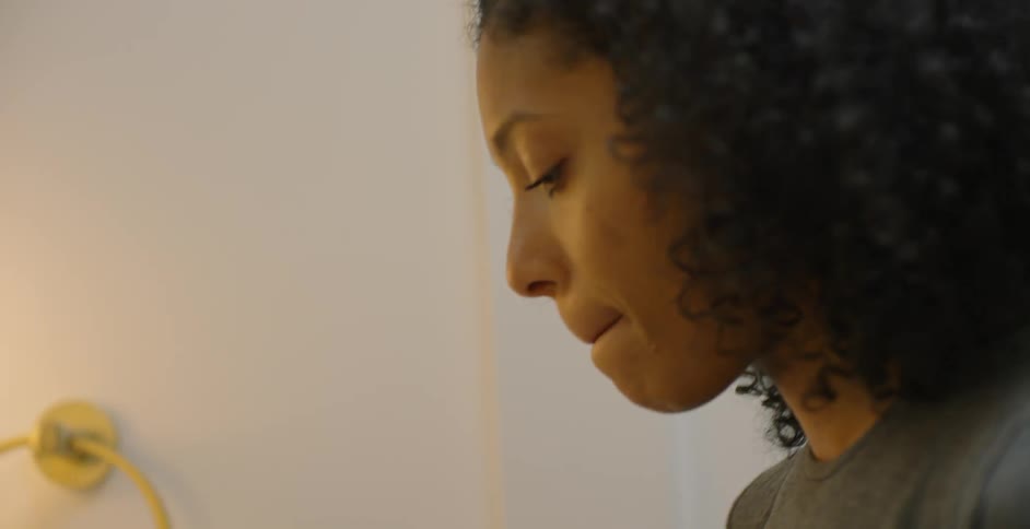 Woman puts on lip gloss