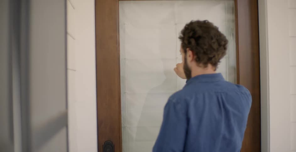 The man knocks on the door outside