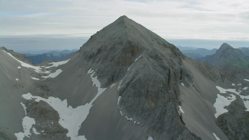 The mountains are covered with slight snow