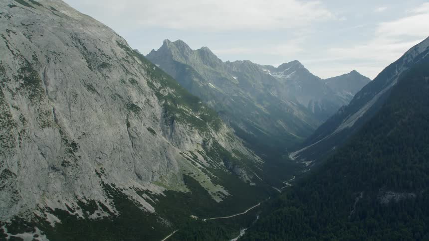 Rocky mountain range with clouds overhead