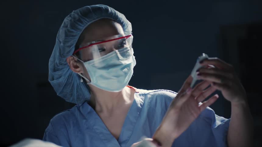 A doctor checks on a patient