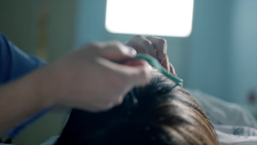 Nurse placing an oxygen mask on a patient