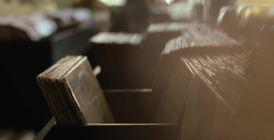 Old vinyl records arranged in bins inside a store