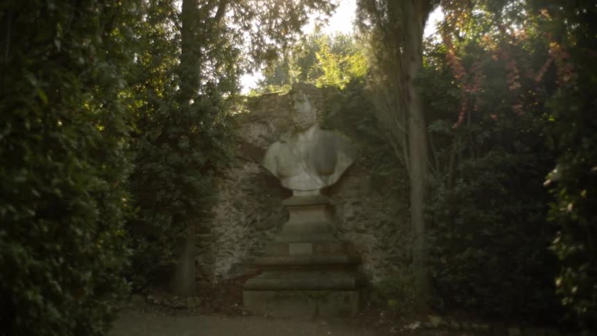 A statue stands in a park