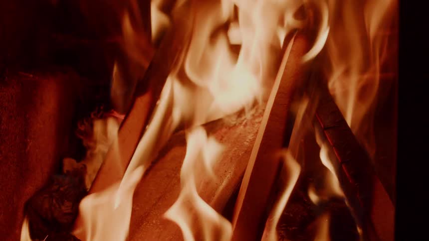 Fire burns pieces of wood