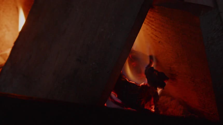 The fire is burning the wood to ash