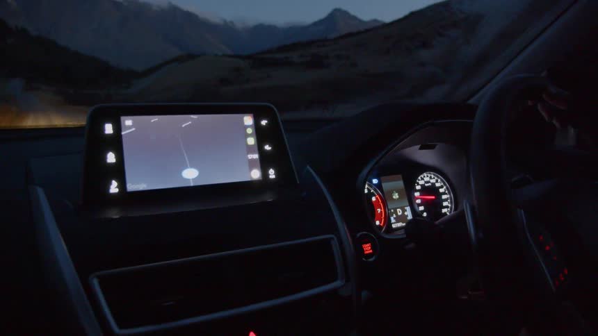 Illuminated screen in a vehicle traveling near the mountains