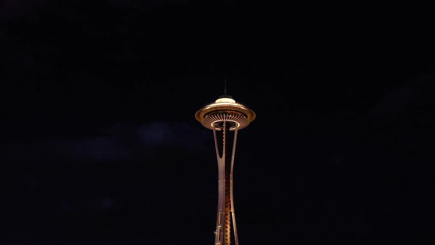 The seattle needle glows at night