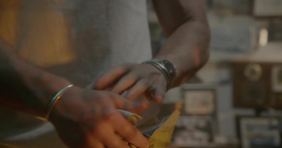 Man wiping his hands after working on his motorcycle