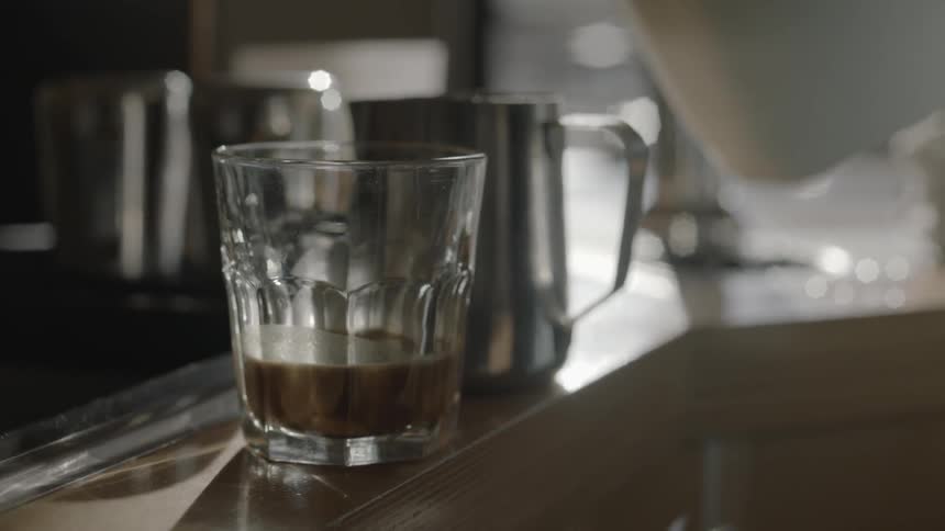 Milk is poured into a metal container