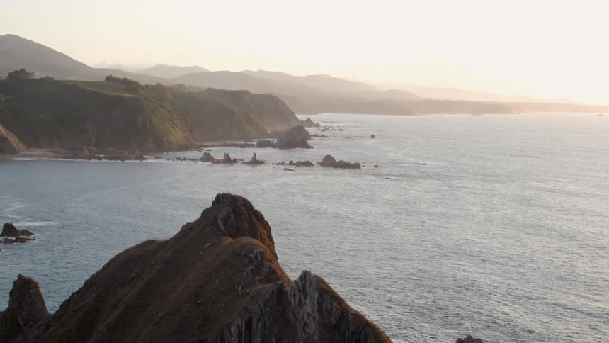 Sun rises over the ocean and islands