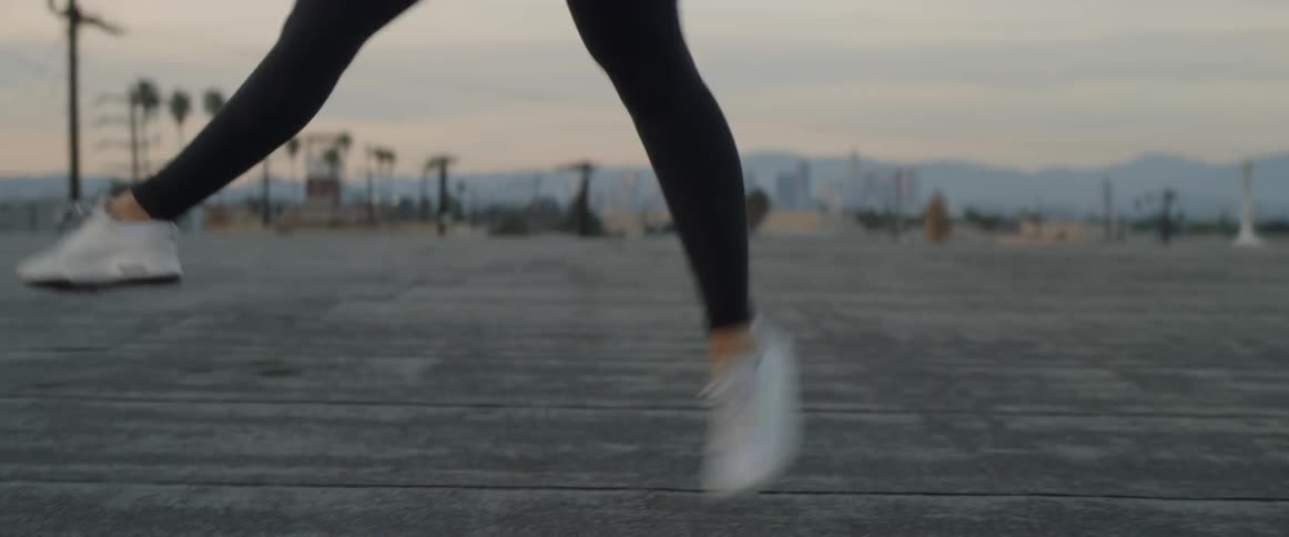 Dancers On Rooftop Overlooking City