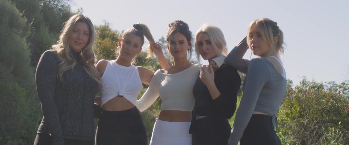 Five women standing in the sun