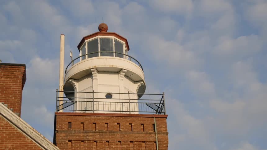 A cloudy sky above a lighthouse
